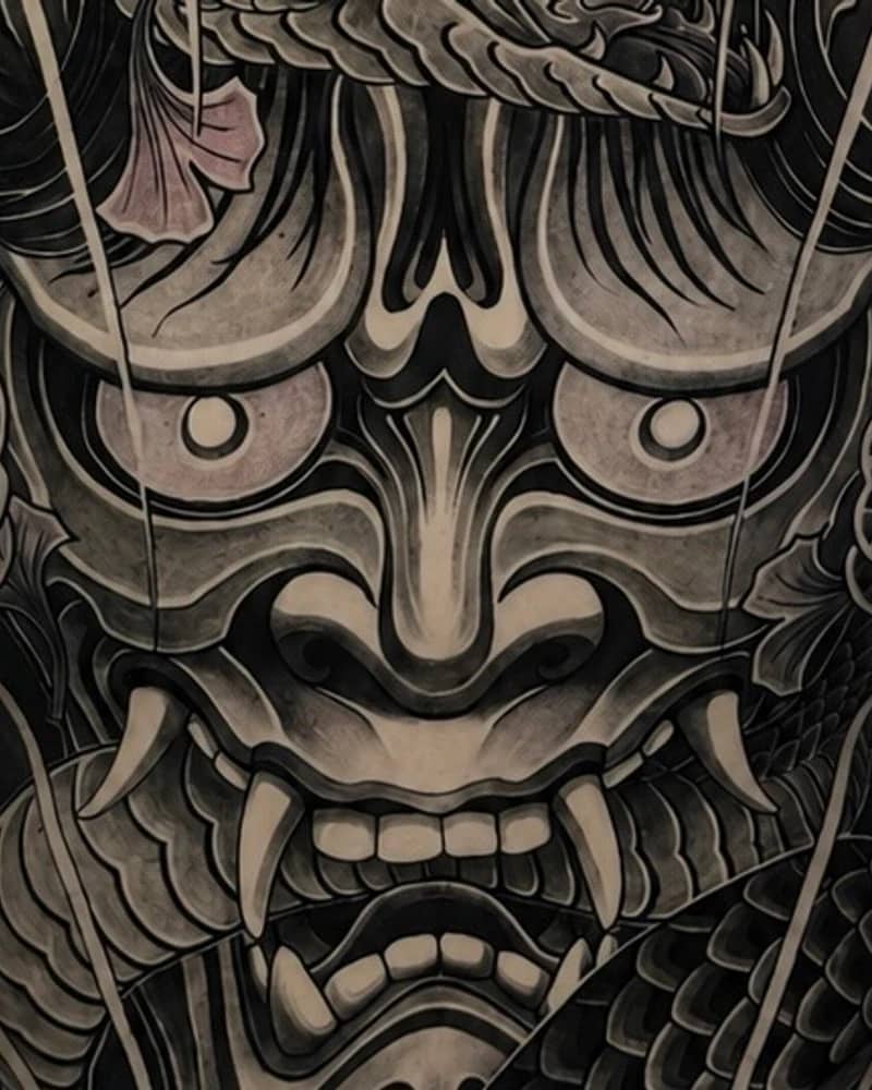 Japanese black and grey leg tattoo with samurai kabuto portrait and mounted samurai scene at Bloodline Tattoo Bali